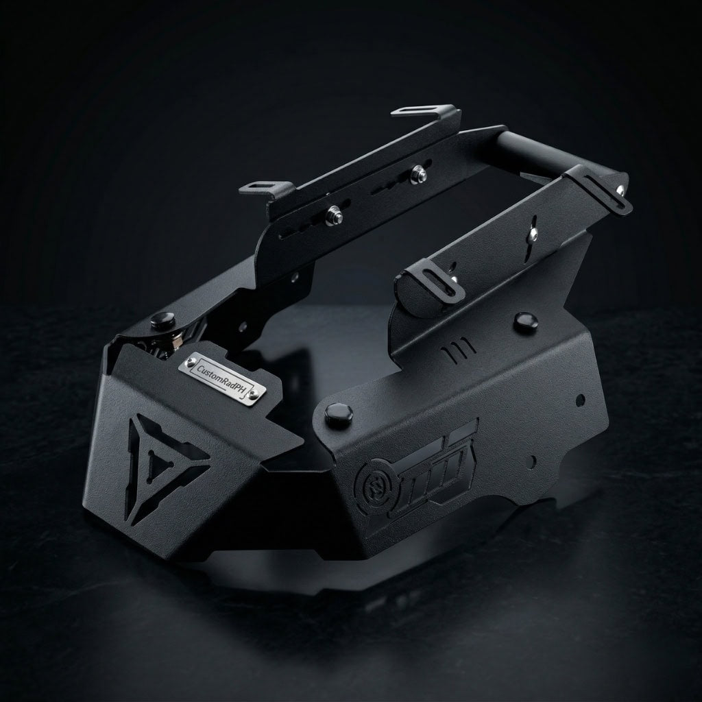 Black powder-coated CNC steel Honda ADV 160 Face Enhancer by CustomradPH, featuring a distinct triangular front cutout, riveted metal badge, and slotted side brackets designed for an aggressive front fairing styling upgrade.